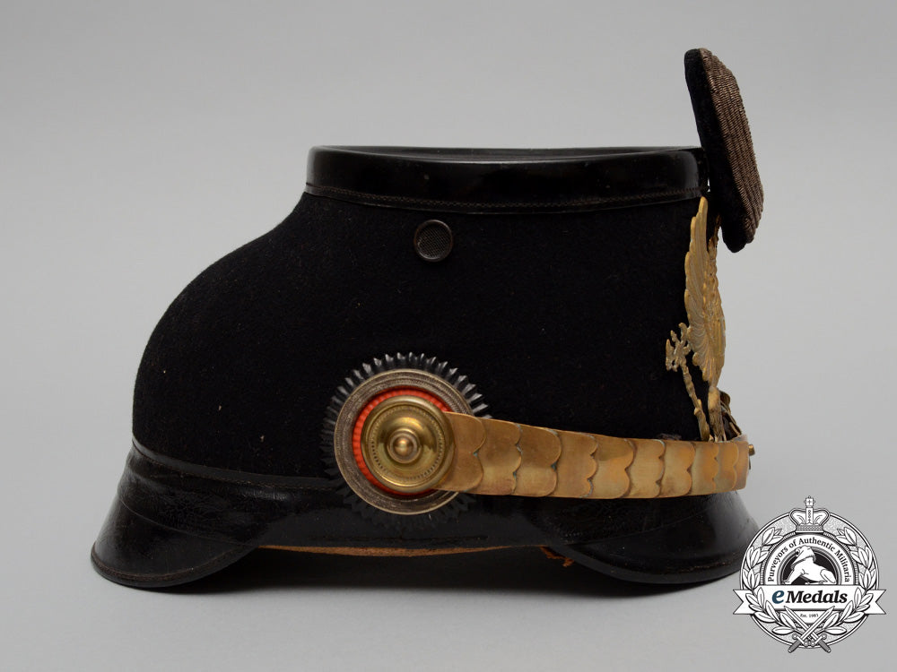 A wartime grey trim enlisted men's shako for Prussian units, Black leather  body, front and back visors. EM field-grey Prussian eagle front plate  attached by two loops with leather inserts, black and