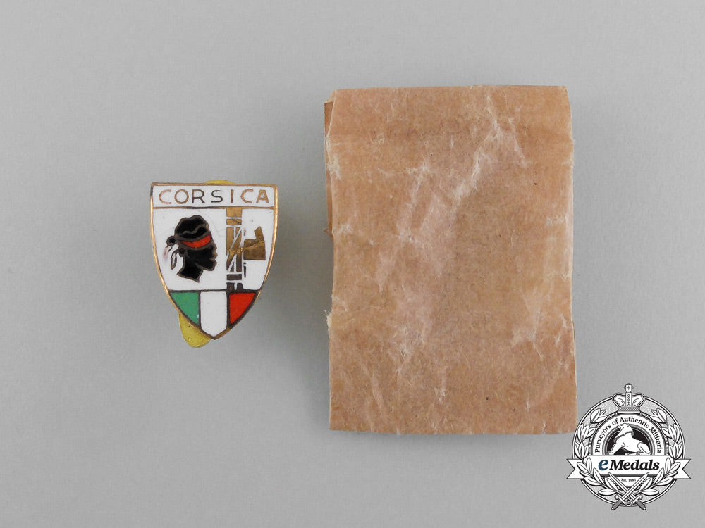 italy,_corsica._a_fascist_party_badge_with_packet_of_issue_e_5982_1