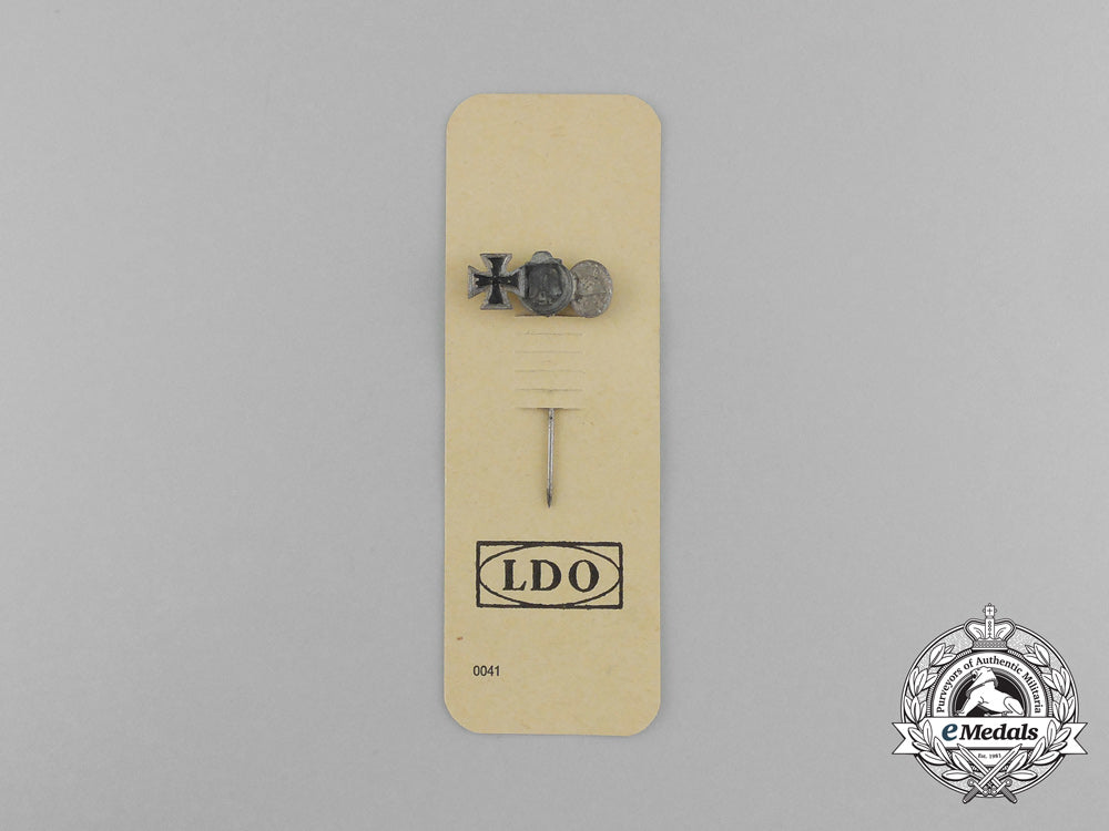 a_second_war_german_miniature_iron_cross_stick_pin_grouping_on_its_ldo_salesman’s_board_e_6031