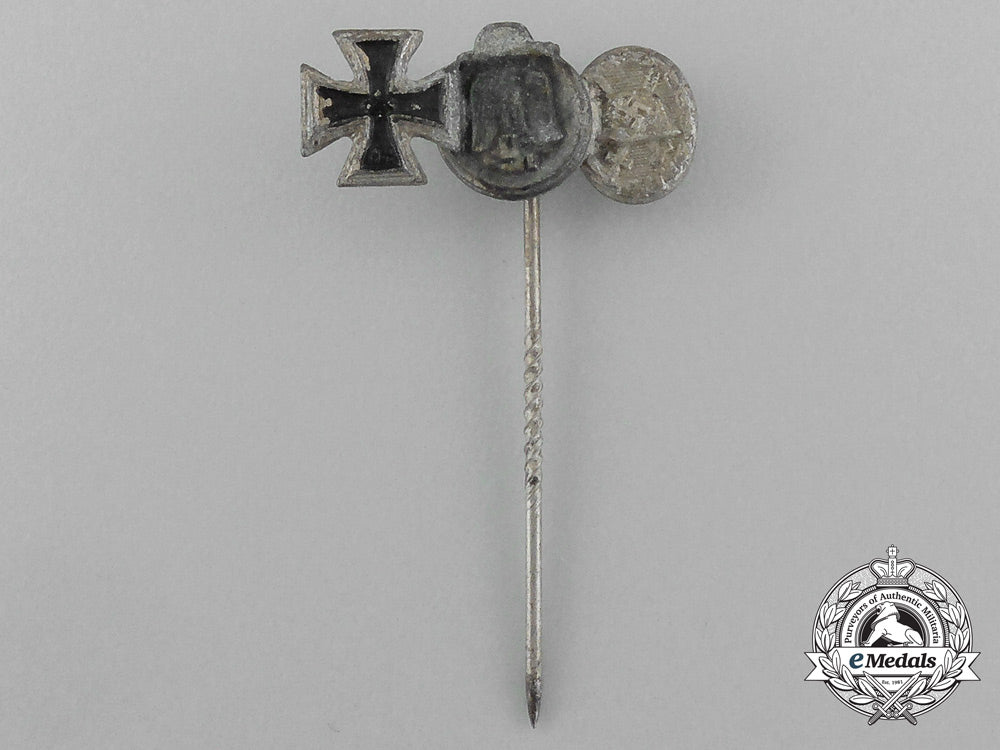 a_second_war_german_miniature_iron_cross_stick_pin_grouping_on_its_ldo_salesman’s_board_e_6032