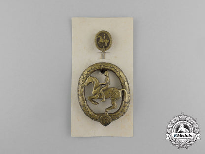 a_mint_second_war_german_bronze_grade_equestrian_badge_and_stick_pin_on_its_display_board_e_6271