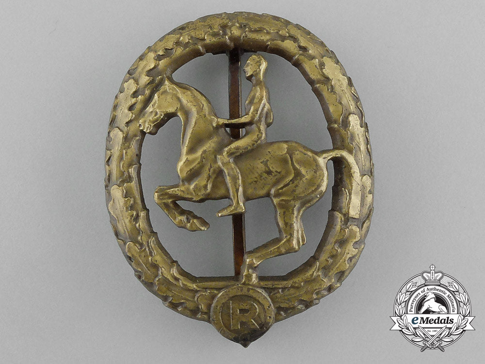 a_mint_second_war_german_bronze_grade_equestrian_badge_and_stick_pin_on_its_display_board_e_6272