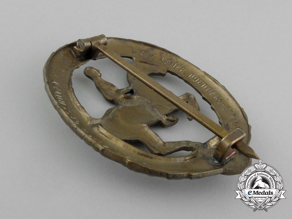 a_mint_second_war_german_bronze_grade_equestrian_badge_and_stick_pin_on_its_display_board_e_6275