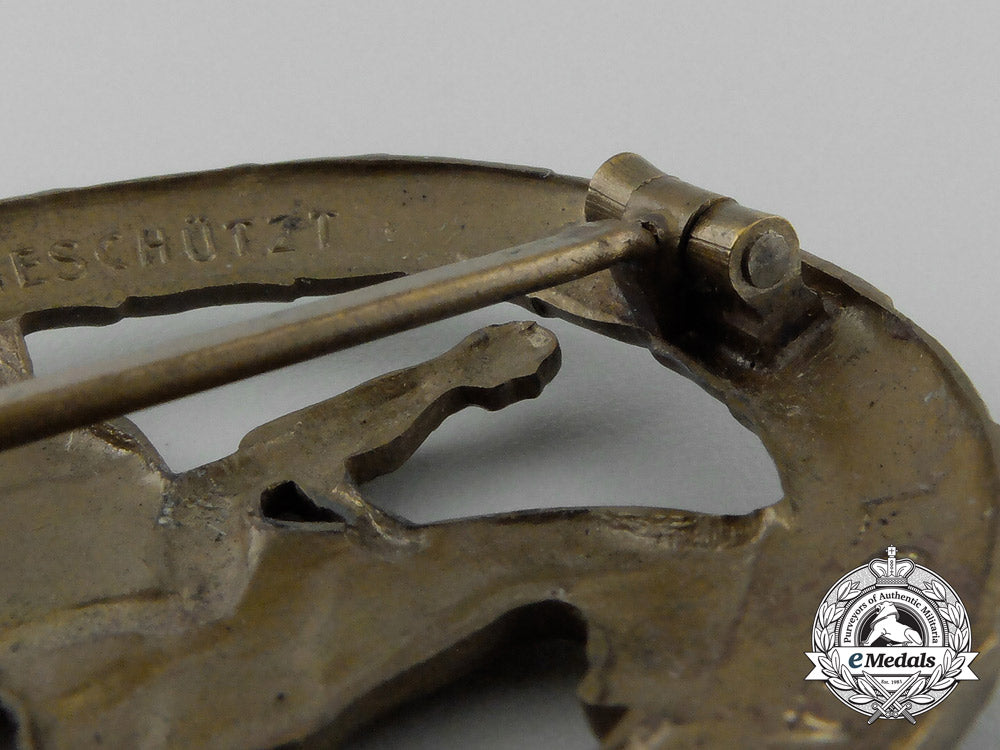 a_mint_second_war_german_bronze_grade_equestrian_badge_and_stick_pin_on_its_display_board_e_6277
