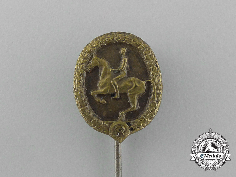 a_mint_second_war_german_bronze_grade_equestrian_badge_and_stick_pin_on_its_display_board_e_6279