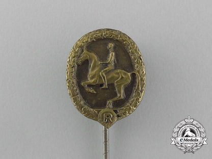 a_mint_second_war_german_bronze_grade_equestrian_badge_and_stick_pin_on_its_display_board_e_6279