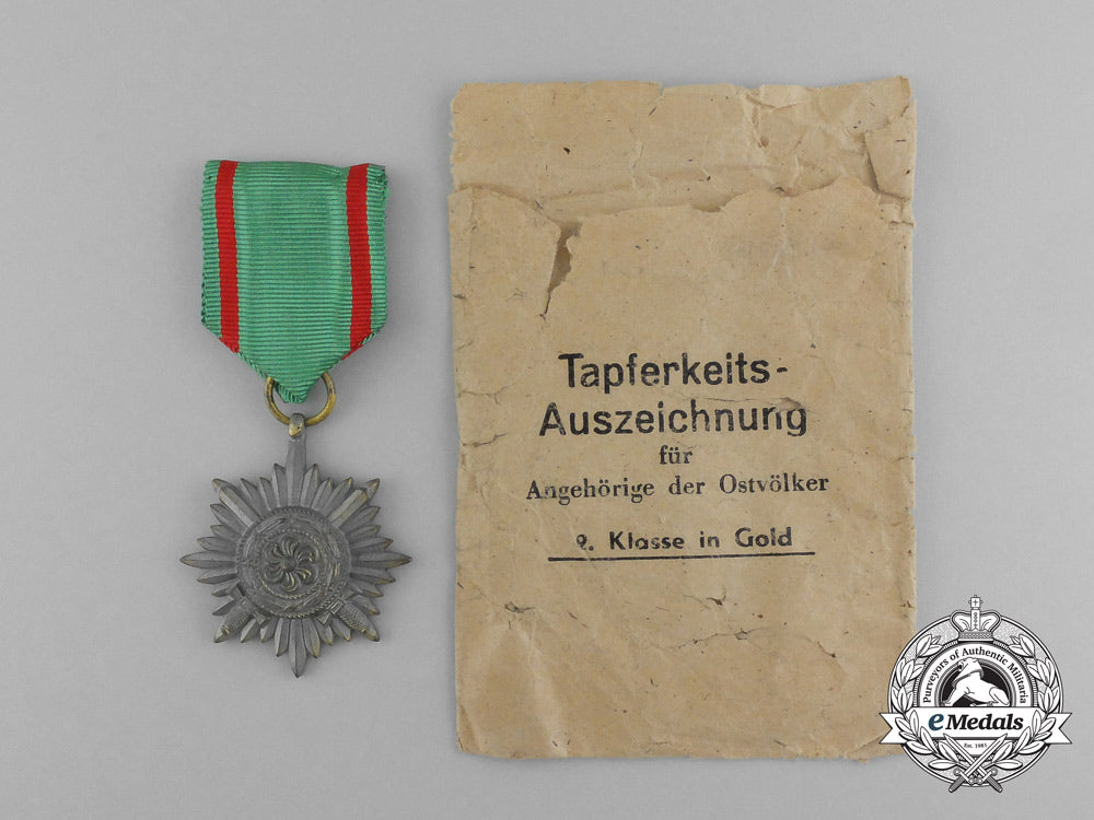 a_gold_grade_eastern_people_bravery_decoration;2_nd_class_by_r._wächtler&_lange_in_its_packet_of_issue_e_6299