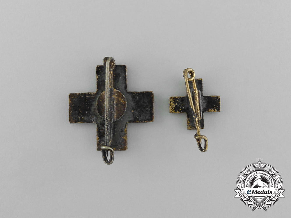 a_grouping_of_two_drk(_deutsches_rotes_kreuz)_badges_e_6482
