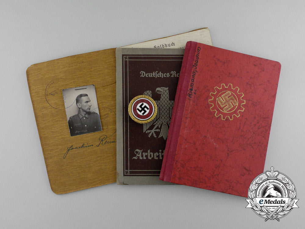 a_large_golden_party_badge_with_documents_to_wehrmacht_gefreiter_reimann_e_6546