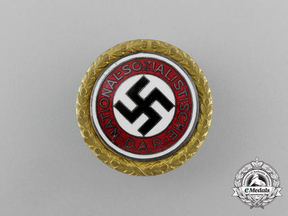 a_large_golden_party_badge_with_documents_to_wehrmacht_gefreiter_reimann_e_6547