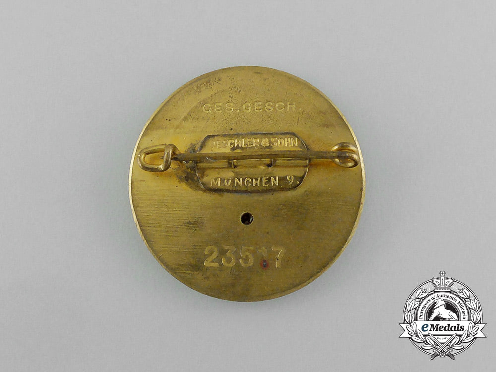 a_large_golden_party_badge_with_documents_to_wehrmacht_gefreiter_reimann_e_6548