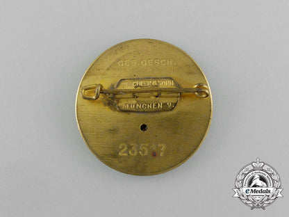 a_large_golden_party_badge_with_documents_to_wehrmacht_gefreiter_reimann_e_6548