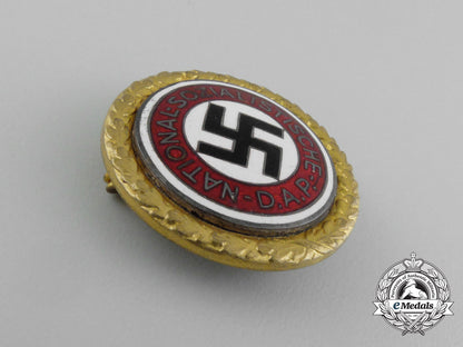 a_large_golden_party_badge_with_documents_to_wehrmacht_gefreiter_reimann_e_6549