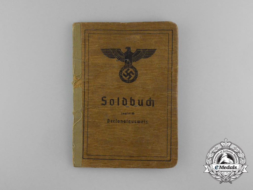 a_large_golden_party_badge_with_documents_to_wehrmacht_gefreiter_reimann_e_6551