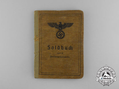 a_large_golden_party_badge_with_documents_to_wehrmacht_gefreiter_reimann_e_6551
