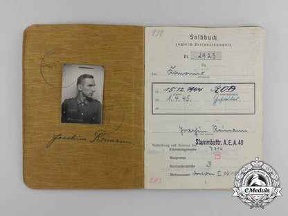 a_large_golden_party_badge_with_documents_to_wehrmacht_gefreiter_reimann_e_6552