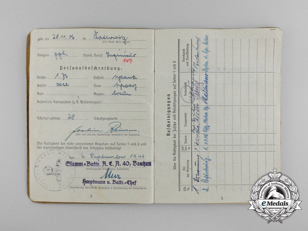 a_large_golden_party_badge_with_documents_to_wehrmacht_gefreiter_reimann_e_6553