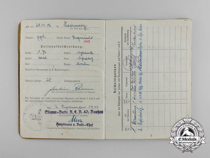 a_large_golden_party_badge_with_documents_to_wehrmacht_gefreiter_reimann_e_6553
