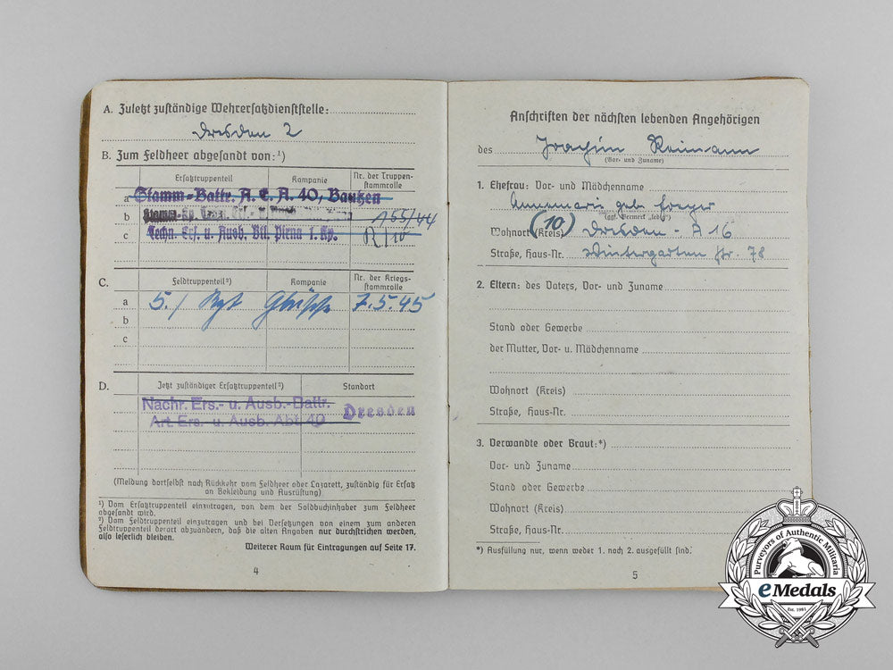 a_large_golden_party_badge_with_documents_to_wehrmacht_gefreiter_reimann_e_6554