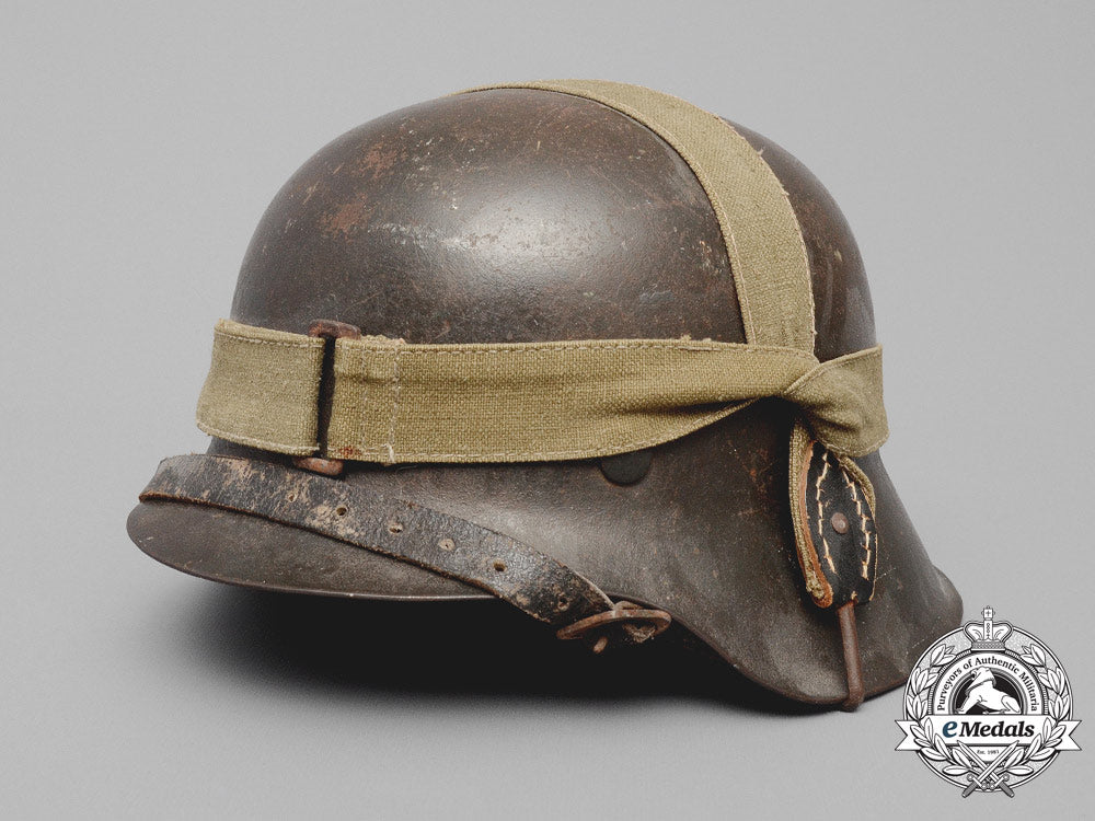 germany,_heer._an_m42_wehrmacht_stahlhelm_with_a_m31_bread_bag_strap_e_8014