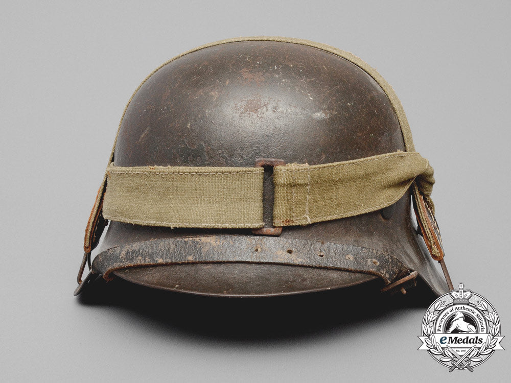 germany,_heer._an_m42_wehrmacht_stahlhelm_with_a_m31_bread_bag_strap_e_8015