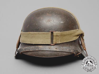 germany,_heer._an_m42_wehrmacht_stahlhelm_with_a_m31_bread_bag_strap_e_8015