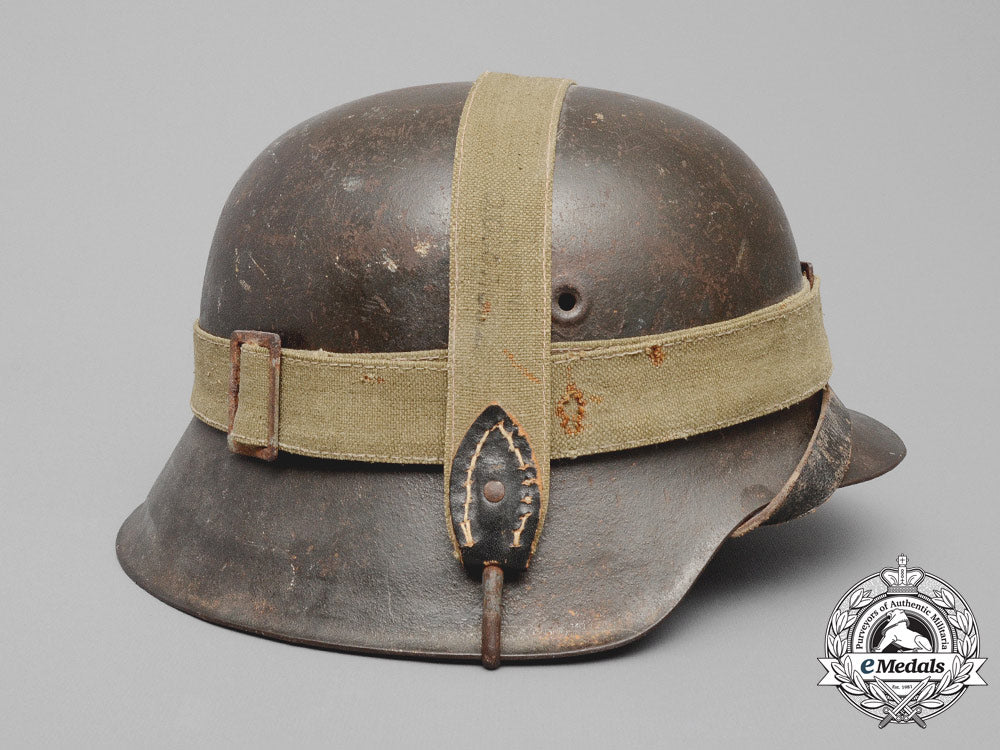 germany,_heer._an_m42_wehrmacht_stahlhelm_with_a_m31_bread_bag_strap_e_8016