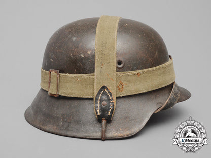 germany,_heer._an_m42_wehrmacht_stahlhelm_with_a_m31_bread_bag_strap_e_8016