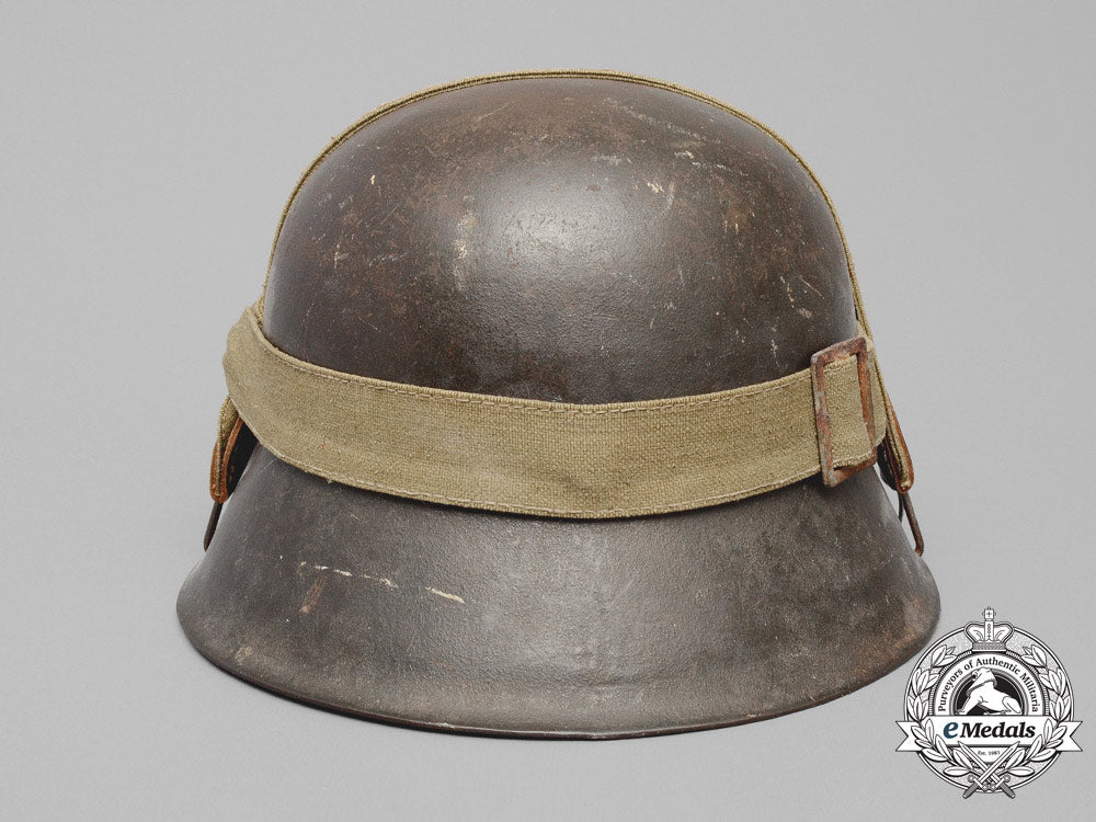 germany,_heer._an_m42_wehrmacht_stahlhelm_with_a_m31_bread_bag_strap_e_8017