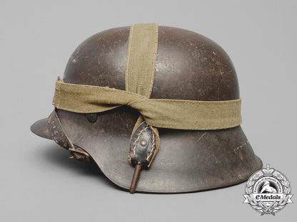 germany,_heer._an_m42_wehrmacht_stahlhelm_with_a_m31_bread_bag_strap_e_8018
