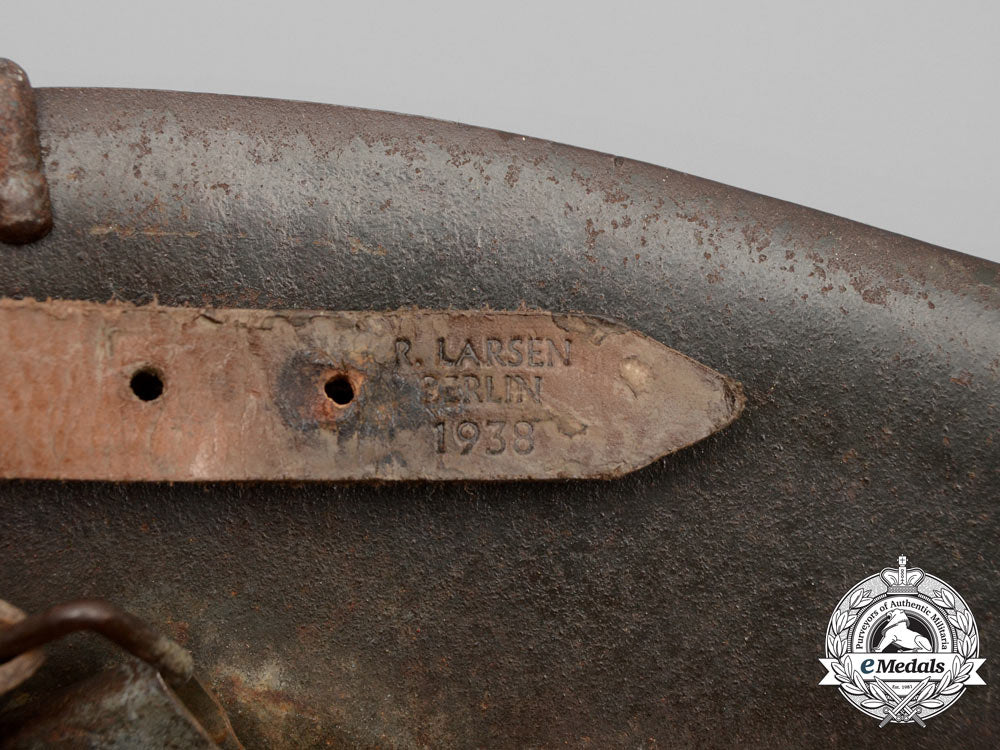 germany,_heer._an_m42_wehrmacht_stahlhelm_with_a_m31_bread_bag_strap_e_8021