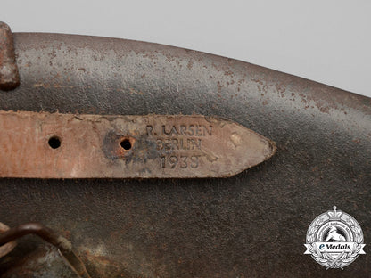 germany,_heer._an_m42_wehrmacht_stahlhelm_with_a_m31_bread_bag_strap_e_8021