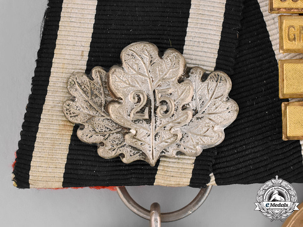 prussia,_state._a_four_piece_medal_bar_with_an_iron_cross_jubilee_oakleaf_and_campaign_bars_emd_2102_1