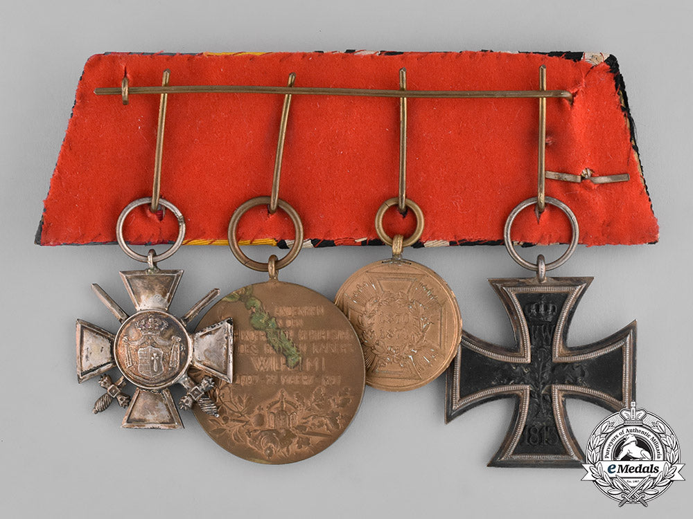 prussia,_state._a_four_piece_medal_bar_with_an_iron_cross_jubilee_oakleaf_and_campaign_bars_emd_2104_1