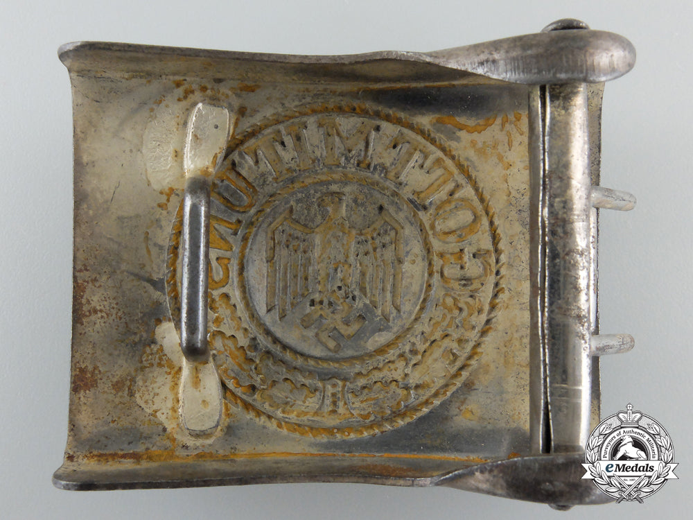 an_army_buckle_in_smooth_steel;_painted_aluminum_f_385