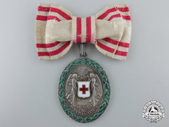 An Austrian Honour Decoration Of The Red Cross; Silver Grade Medal With War Decoration, Ladies 1864-1914