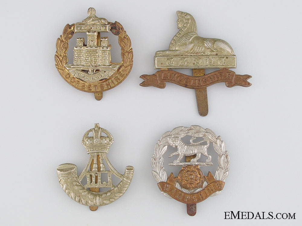 four_first&_second_war_british_cap_badges_four_first___sec_5362a24d9c9e0