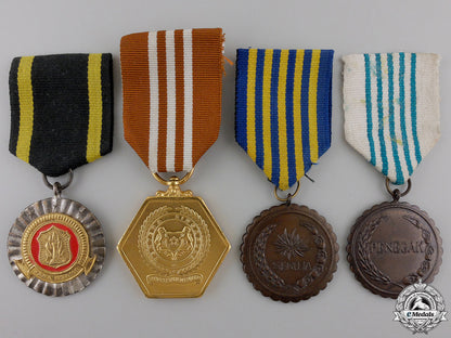 four_medals_from_indonesia&_singapore_four_medals_from_553e5ad39ffd4