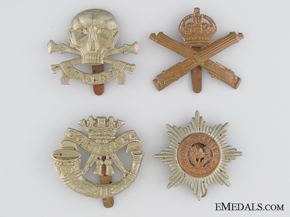 four_wwi&_wwii_british_cap_badges_four_wwi___wwii__5362a16c12f57