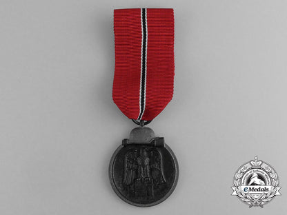 a_second_war_german_eastern_winter_campaign_medal_in_its_packet_of_issue;_by_deschler&_sohn_g_072_1