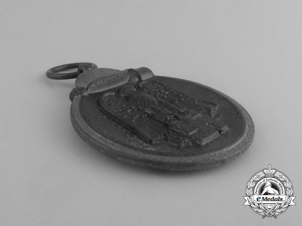 a_second_war_german_eastern_winter_campaign_medal_in_its_packet_of_issue;_by_deschler&_sohn_g_076_1