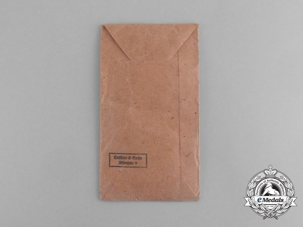 a_second_war_german_eastern_winter_campaign_medal_in_its_packet_of_issue;_by_deschler&_sohn_g_078_1