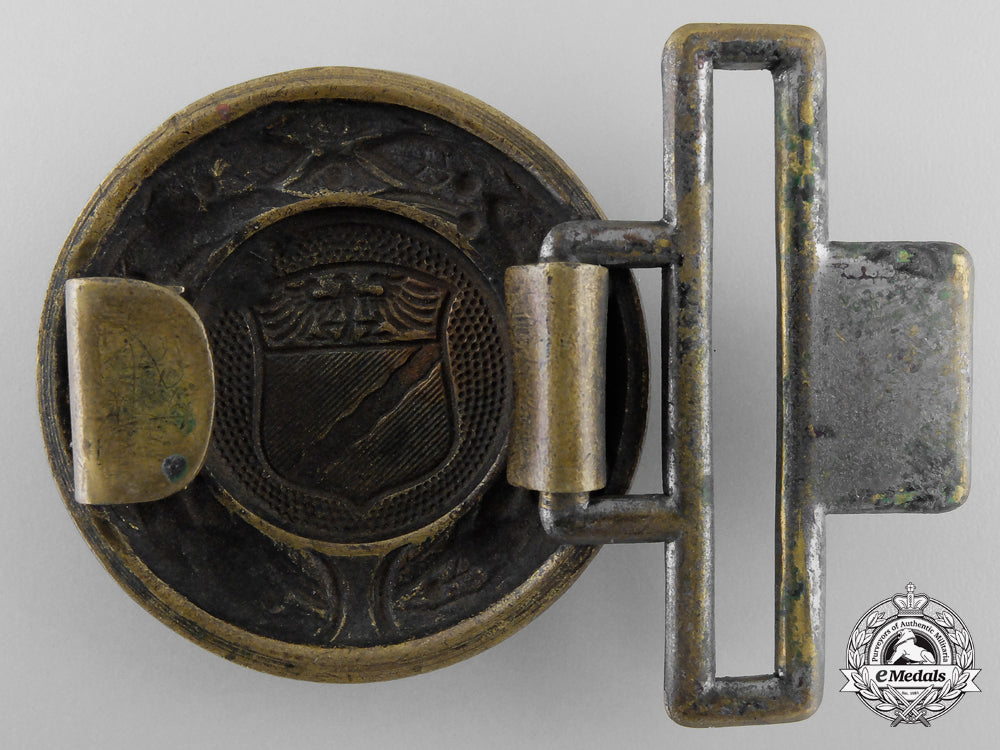 a_rheinland_fire_defence_officer's_belt_buckle;_published_example_h_702