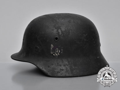 a_single_decal_m40_wehrmacht_heer_helmet_by_v.d._nickelwerke;_bullet_damaged_h_731_1