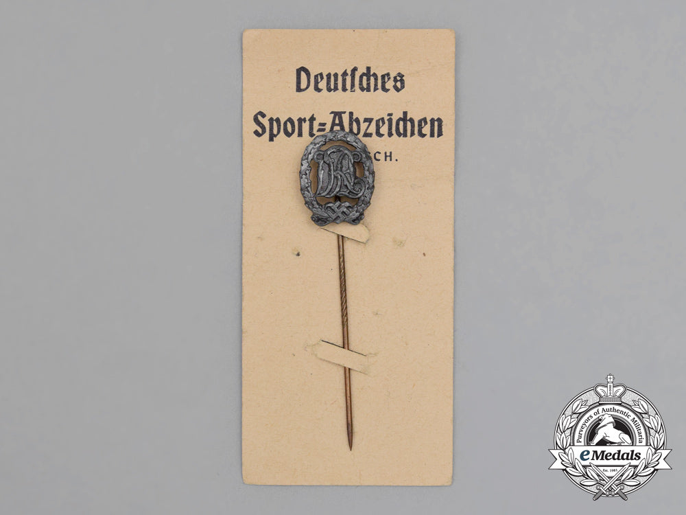 a_silver_grade_drl_sports_badge_miniature_stick_pin_on_its_original_salesman's_board_h_799_1