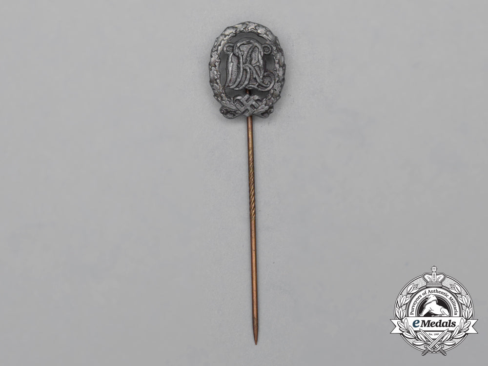 a_silver_grade_drl_sports_badge_miniature_stick_pin_on_its_original_salesman's_board_h_800_1