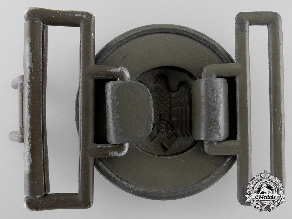 a_tropical_army_officer's_belt_buckle;_published_example_h_923