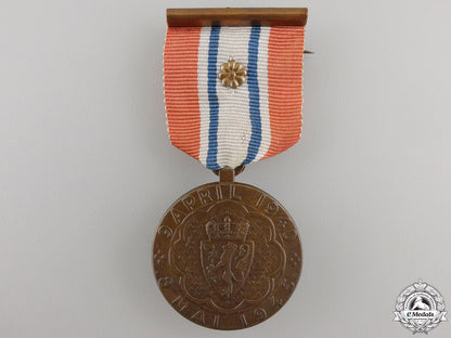 norway._a1940-45_war_medal_with_packet_img_02.jpg5575b0a4687de