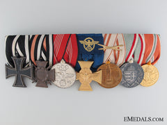 A Seven Piece German Medal Bar With  Matching Miniatures