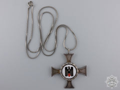 A German Red Cross Sister's Cross; Silver Grade With Wreath
